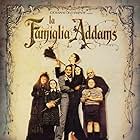 Christina Ricci, Raul Julia, Christopher Lloyd, Anjelica Huston, Judith Malina, Carel Struycken, and Jimmy Workman in The Addams Family (1991)