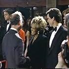 Pierce Brosnan, King Charles III, Tina Turner, and Michael G. Wilson in 007: The Return (1995)