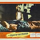 Robert Mitchum, Sally Jane Bruce, and Billy Chapin in The Night of the Hunter (1955)