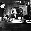 Robert Mitchum, Eddie Golden, and Marie Kean in A Terrible Beauty (1960)