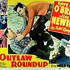 Helen Chapman, Frank McCarroll, James Newill, Dave O'Brien, Cal Shrum, and Guy Wilkerson in Outlaw Roundup (1944)