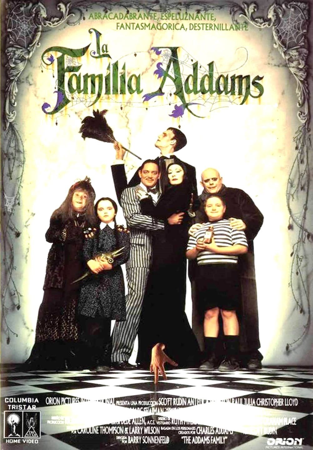 Christina Ricci, Raul Julia, Christopher Lloyd, Anjelica Huston, Judith Malina, Carel Struycken, and Jimmy Workman in The Addams Family (1991)