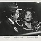 Merle Oberon and Warren Stevens in The Price of Fear (1956)