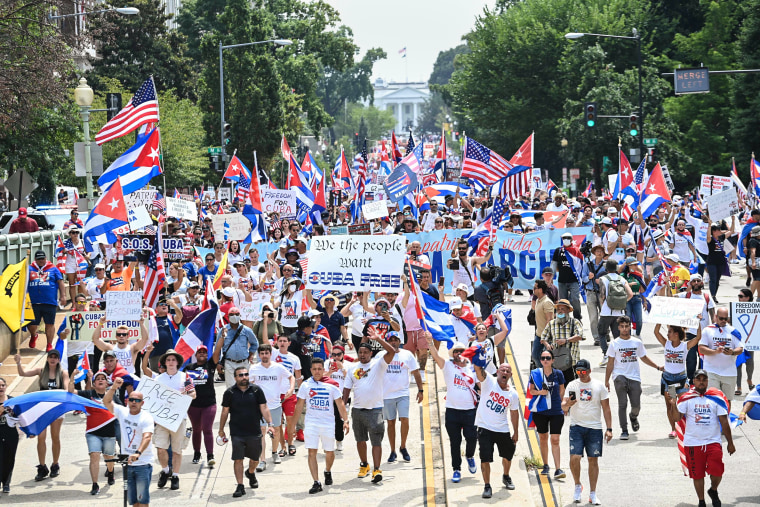 Image: People march during a protest in support of continued anti-government protests in Cuba near the White House on July 26, 2021.
