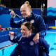 United States' Sarah Bacon and Kassidy Cook celebrate winning silver in the women's synchronised 3m springboard diving at the 2024 Paris Olympics.