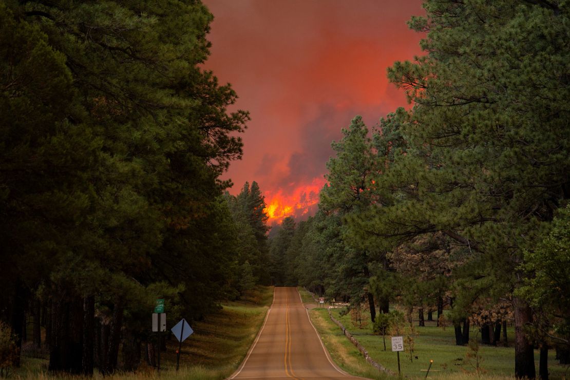 Smoke pluming from the South Fork Fire rises above the tree line as the fire progresses from the Mescalero Apache Reservation to the Lincoln National Forest.