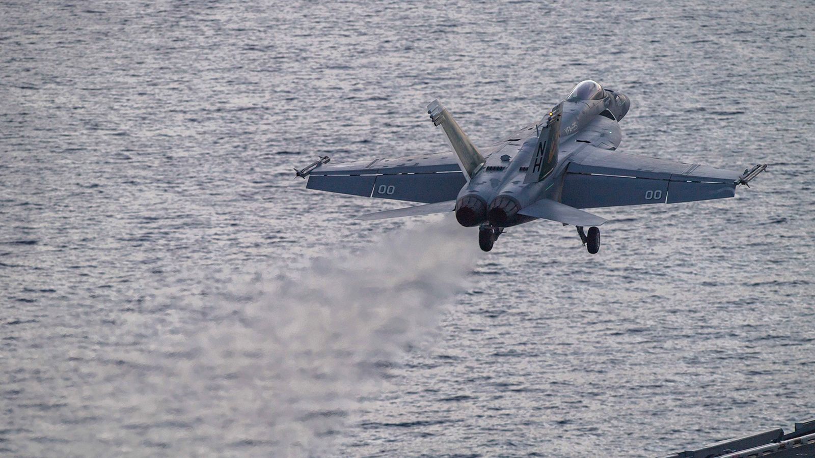 In this photograph released by the U.S. Navy, an F/A-18 Super Hornet launches off the flight deck of the Nimitz-class aircraft carrier USS Theodore Roosevelt on July 5, 2024, in the South China Sea. The Roosevelt is replacing the USS Dwight D. Eisenhower in the Navy's campaign against attacks by Yemen's Houthi rebels targeting shipping in the Red Sea corridor over the Israel-Hamas war in the Gaza Strip.