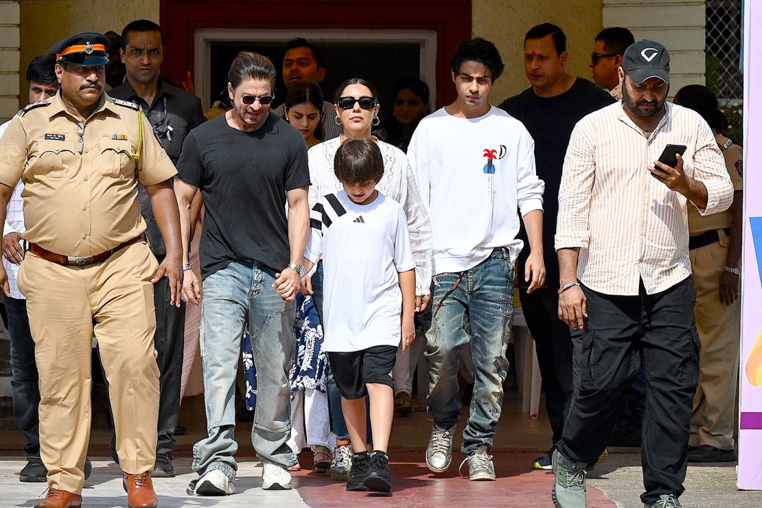 Bollywood actor Shah Rukh Khan, along with his family, leaves a polling booth after casting his ballot in Mumbai on May 20, 2024.