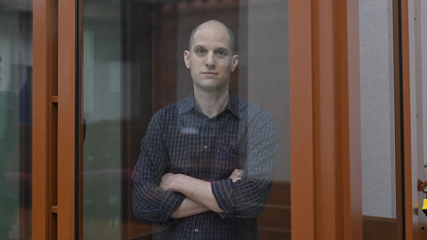 US journalist Evan Gershkovich, accused of espionage, looks out from inside a glass defendants' cage prior to a hearing in Yekaterinburg's Sverdlovsk Regional Court on June 26, 2024. (Photo by NATALIA KOLESNIKOVA / AFP) (Photo by NATALIA KOLESNIKOVA/AFP via Getty Images)