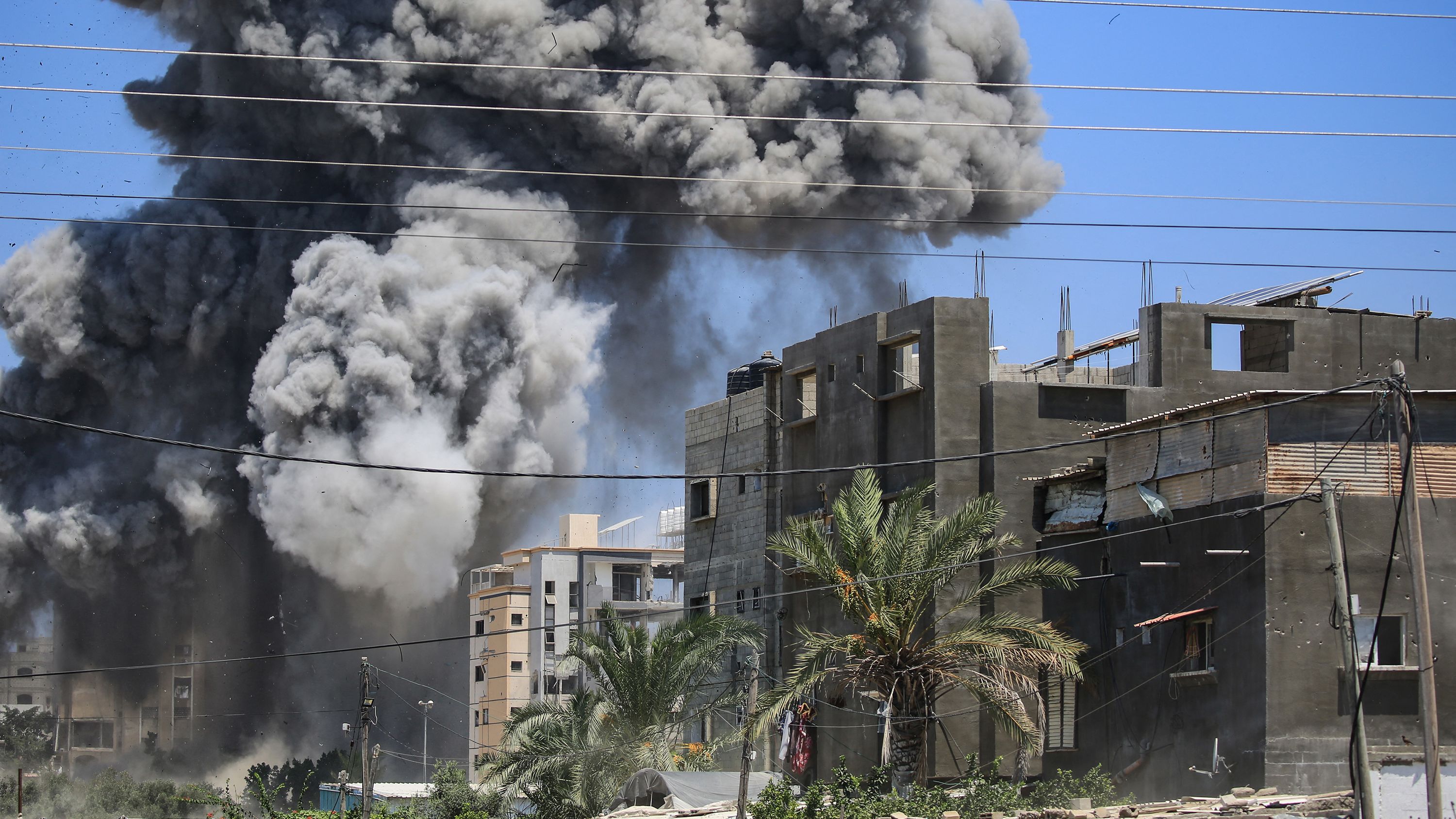 Smoke rises from a building hit by an Israeli strike in Nuseirat in the central Gaza Strip on Saturday.