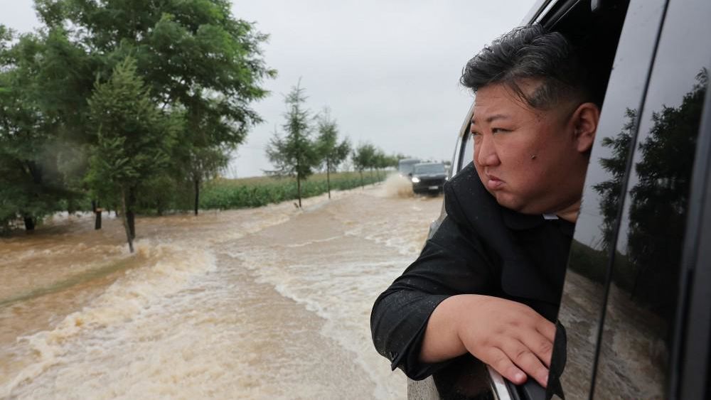 North Korean leader Kim Jong Un inspects a flood-hit area along the country's border with China on July 28.