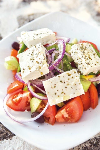 Greek salad with feta and herbs at Methismeni Politeia restaurant Milos.