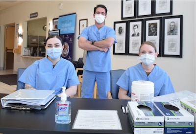 A masking must...all staff, such as Hospitalman Paighton Scott (left), Hospital Corpsman 3rd Class Katelynn Martin (right) and Hospitalman Stephen Mathis (center), patients and visitors at Navy Medicine Readiness and Training Unit Everett are required to wear cloth face covering(s) as part of the overlapping commitment to reduce the spread of the COVID-19 virus, as well as enhance the protection of the health and well-being of everyone (Official Navy photo by MC3 Meagan Christoph).