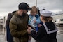 A Sailor reunites with her family after Arleigh Burke-class guided-missile destroyer USS McCampbell (DDG 85) arrived to its new homeport of Naval Station Everett, Washington April 8, 2022. Prior to relocating, the ship underwent an extensive Depot Modernization Period in Portland, Oregon that spanned more than 18 months. The modernization included improvements to the hull, mechanical systems, electrical technology, wireless communications, and weapon upgrades. This routine maintenance ensures the ship can continue to be mission capable throughout its expected service life.