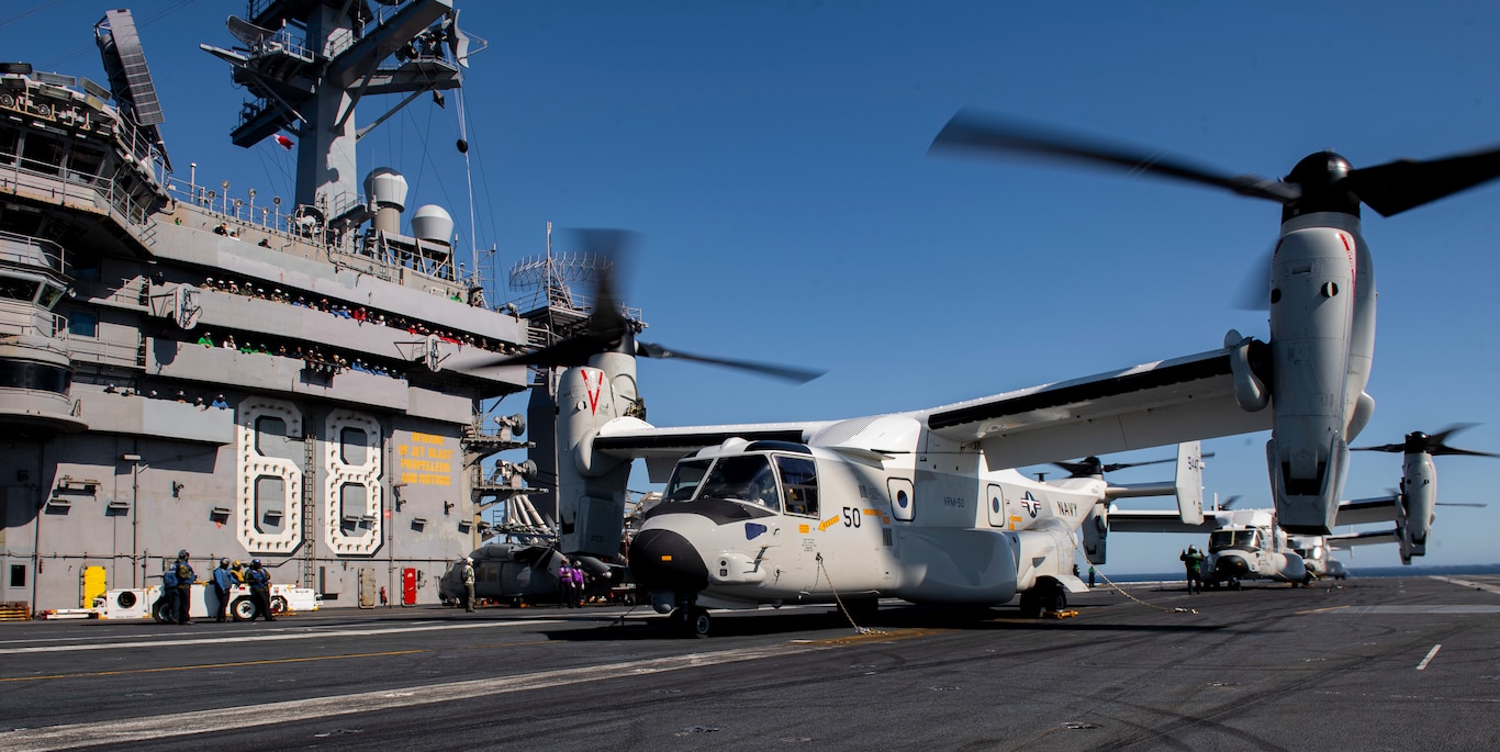Three CMV-22B Osprey's, from the "Sunhawks" of Fleet Logistics Multi-Mission Squadron (VRM) 50, rest after landing on the flight deck of the aircraft carrier USS Nimitz (CVN 68). Nimitz is underway conducting routine operations.