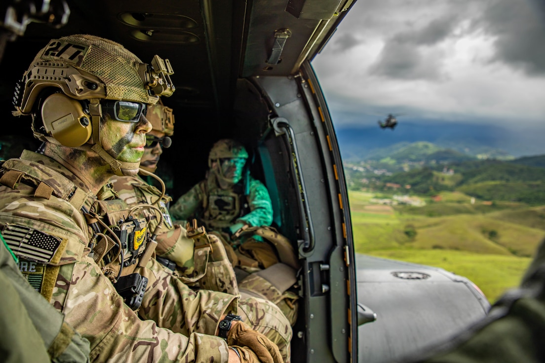 U.S. Army Soldiers assigned to 1st Battalion, 54th Security Force Assistance Brigade ride in a Eurocopter AS532 Cougar during Southern Vanguard 22 in Lorena, Brazil, Dec. 7, 2021. U.S. and Brazilian army soldiers took part in the air assault exercise, which was the largest deployment of a U.S Army unit to train with the Brazilian army forces in Brazil. (U.S Army photo by Pfc. Joshua Taeckens)