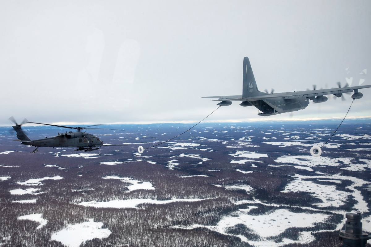 A 211th Rescue Squadron HC-130J Combat King II refuels a 210th Rescue Squadron HH-60G Pave Hawk during training at Joint Base Elmendorf-Richardson, Alaska, March 23, 2020. During a March 30, 2024, medical evacuation mission from JBER to near Ruby about 175 miles west of Fairbanks on the Yukon River, HC-130 refueling was necessary to extend the range of the HH-60.