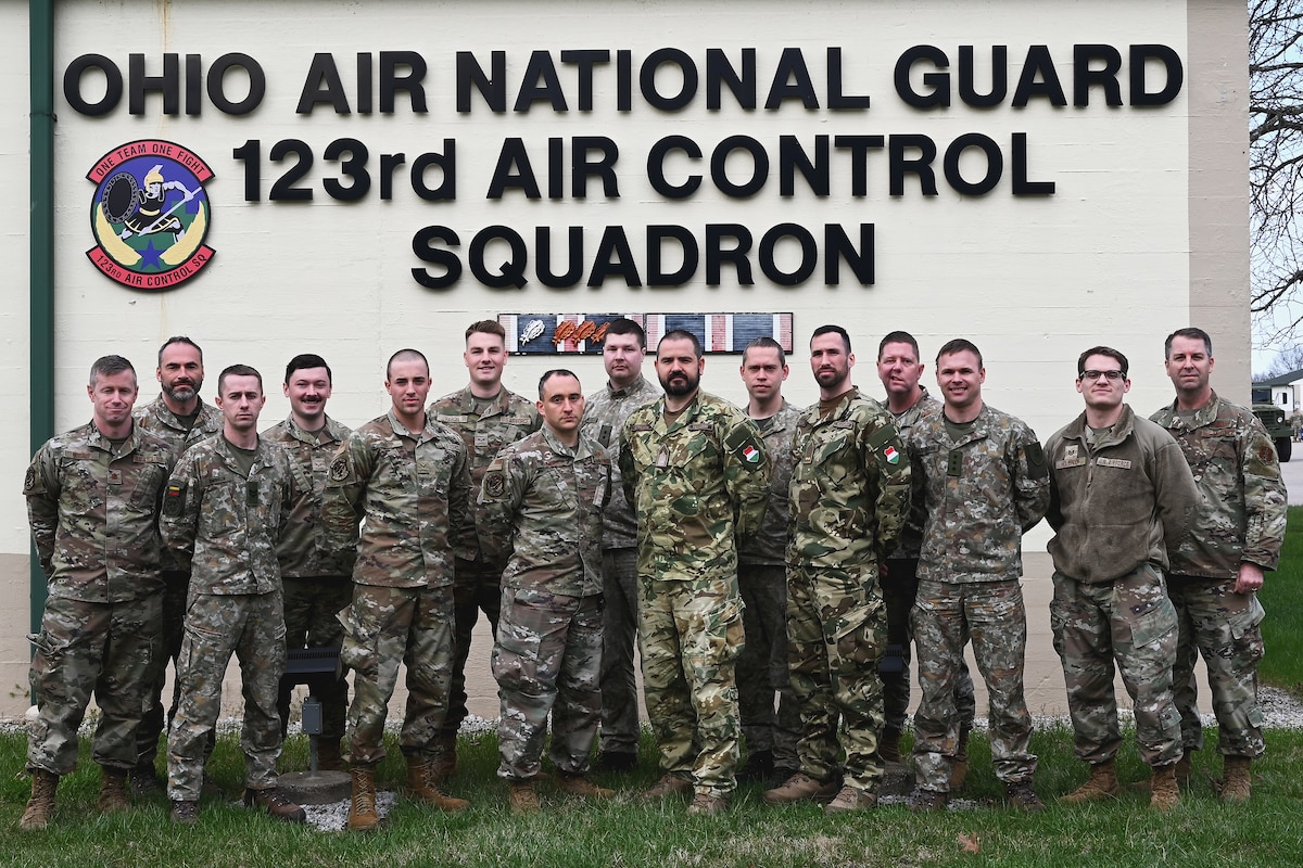 Airmen assigned to the 123rd Air Control Squadron pose for a portrait alongside service members from Lithuania and Hungary during a joint training exercise March 22, 2024, in Blue Ash, Ohio. The training included air battle management, ground control intercept, large-force employment and air-to-air combat beyond visual range.