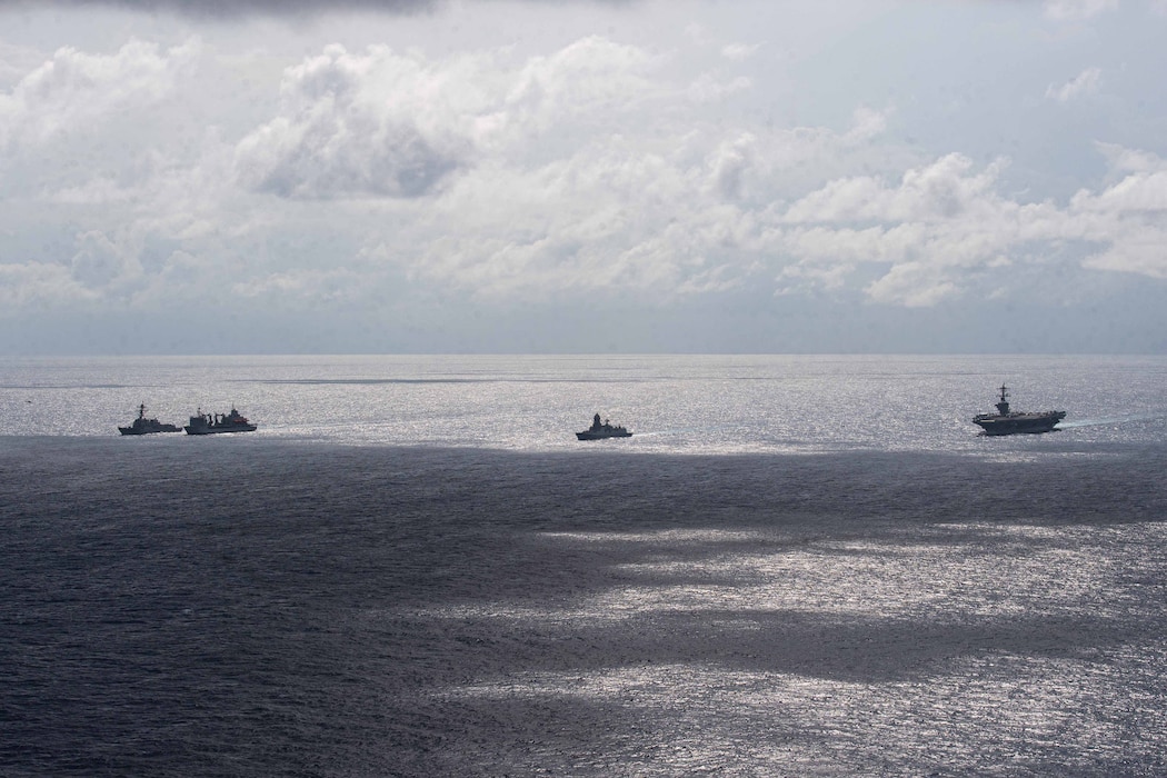 USS Daniel Inouye (DDG 118), left, the Indian navy ships INS Aditya (A59) and INS Visakhapatnam (D66), and USS Theodore Roosevelt (CVN 71) sail together in the Indian Ocean during a joint maritime activity.