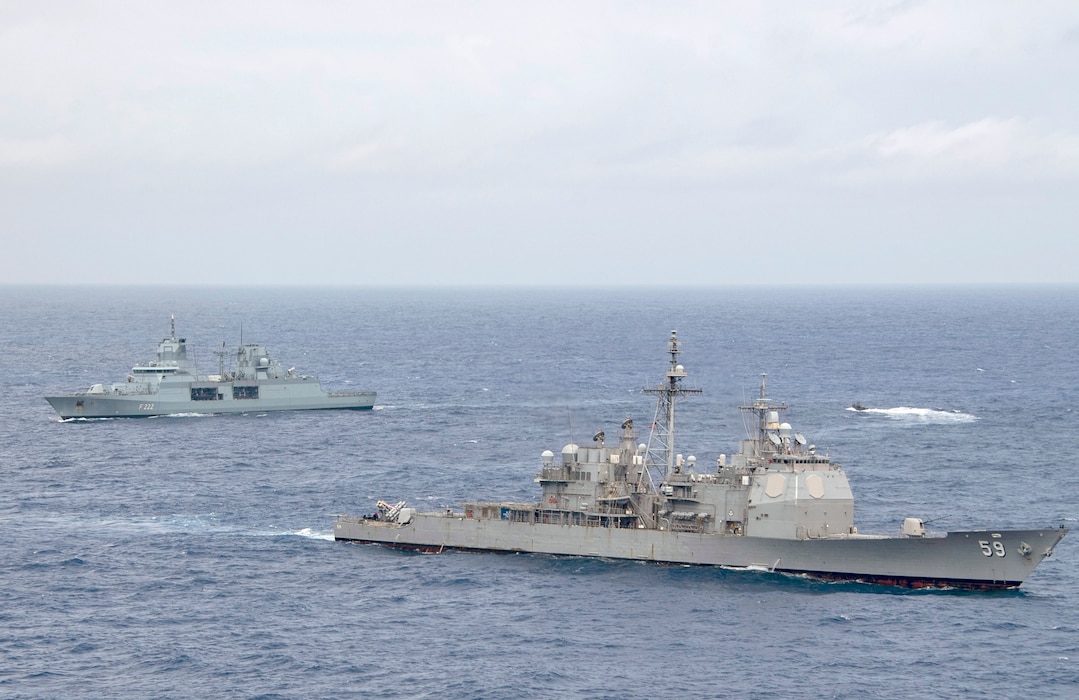USS Princeton (CG 59) and FGS Baden-Wurttemberg (F222) conduct small boat operations during RIMPAC.