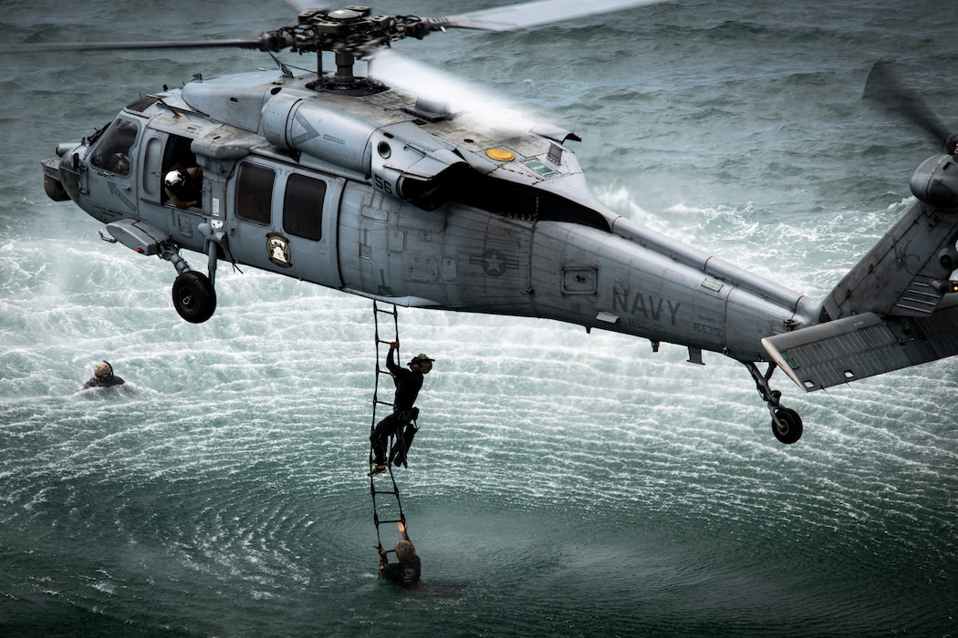 Explosive ordnance disposal technicians from the U.S. Navy, Republic of Korea, Germany, Peru, and Japan conduct a helicopter cast training during Rim of the Pacific (RIMPAC) at Marine Corps Air Station Kaneohe Bay, Hawaii, July 16.