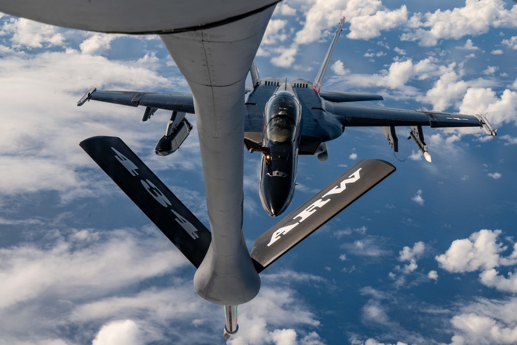 Aircrew with the 927th Air Refueling Wing, Florida operate a U.S. Air Force KC-135 Stratotanker with the 434th Air Refueling Wing, Indiana, to refuel a U.S. Navy FA-18 Super Hornet near Joint Base Pearl Harbor-Hickam, Hawaii, during Exercise Rim of the Pacific (RIMPAC) 2024, July 18.