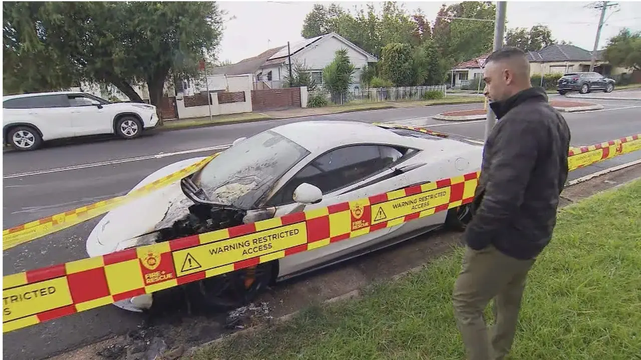 Video: Pedestrian caught setting McLaren on fire