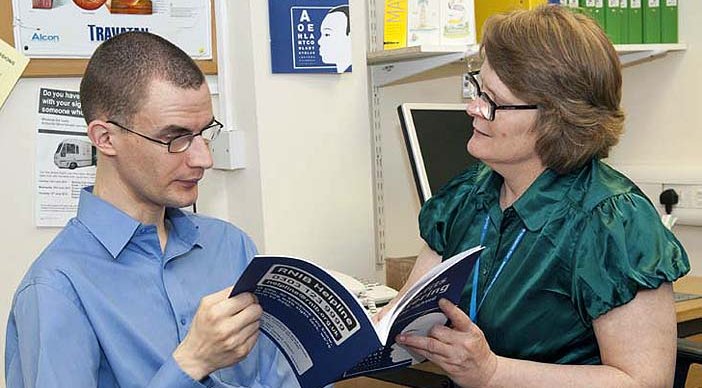 An ECLO guides a person through an information booklet