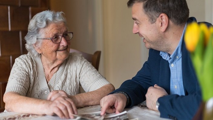 Old lady discussing will with a man