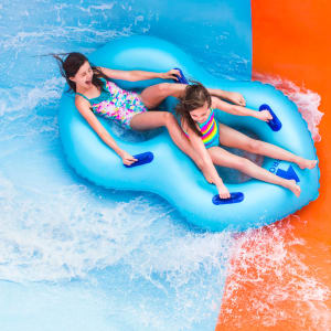 Girls riding Coastline Plunge Vortex water slide