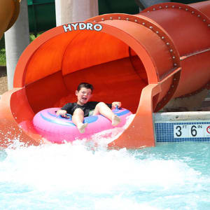 boy riding coastline plunge hydro water slide