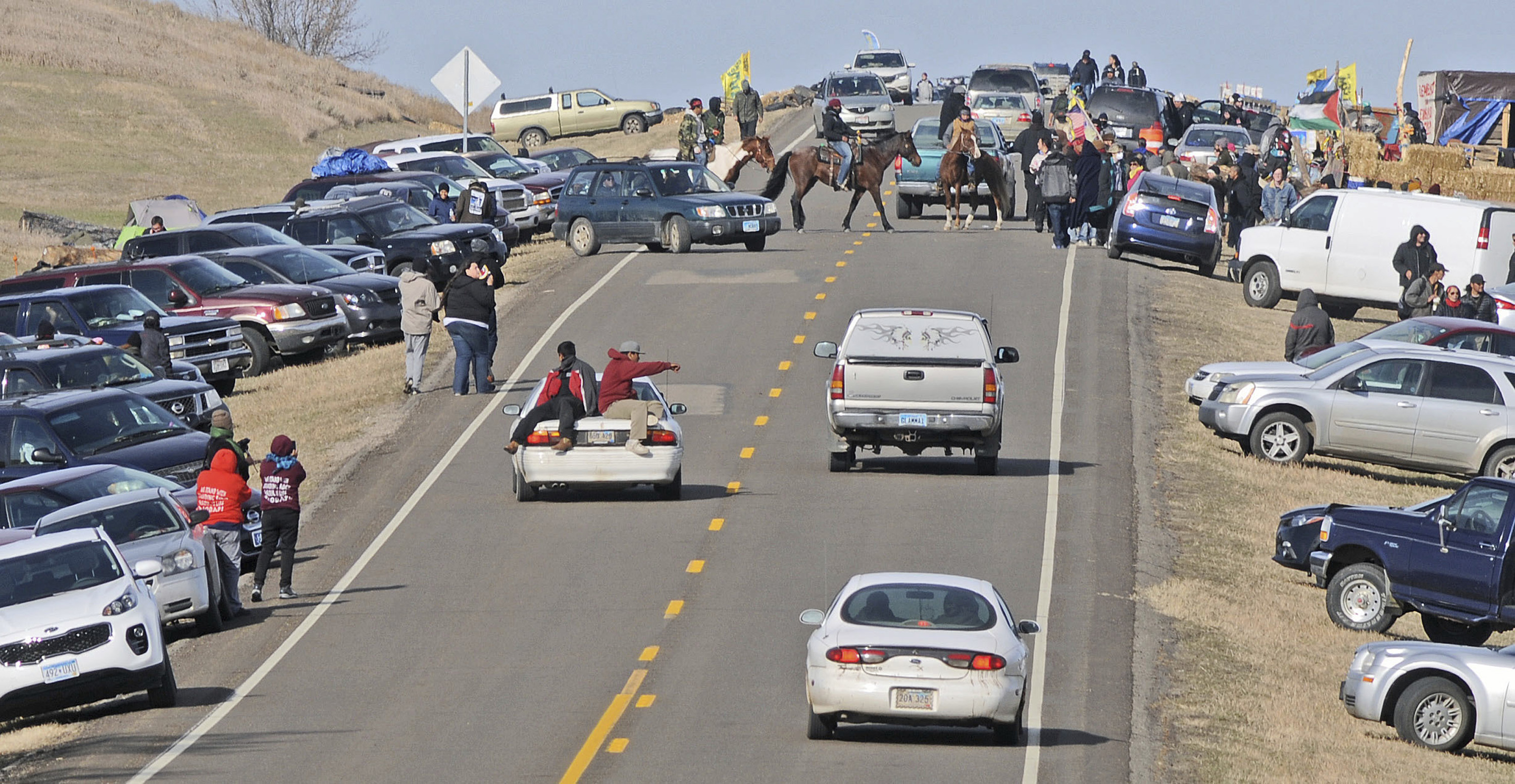 People protesting the Dakota Access Pipeline gather along North Dakota Highway 1806 in Morton County.