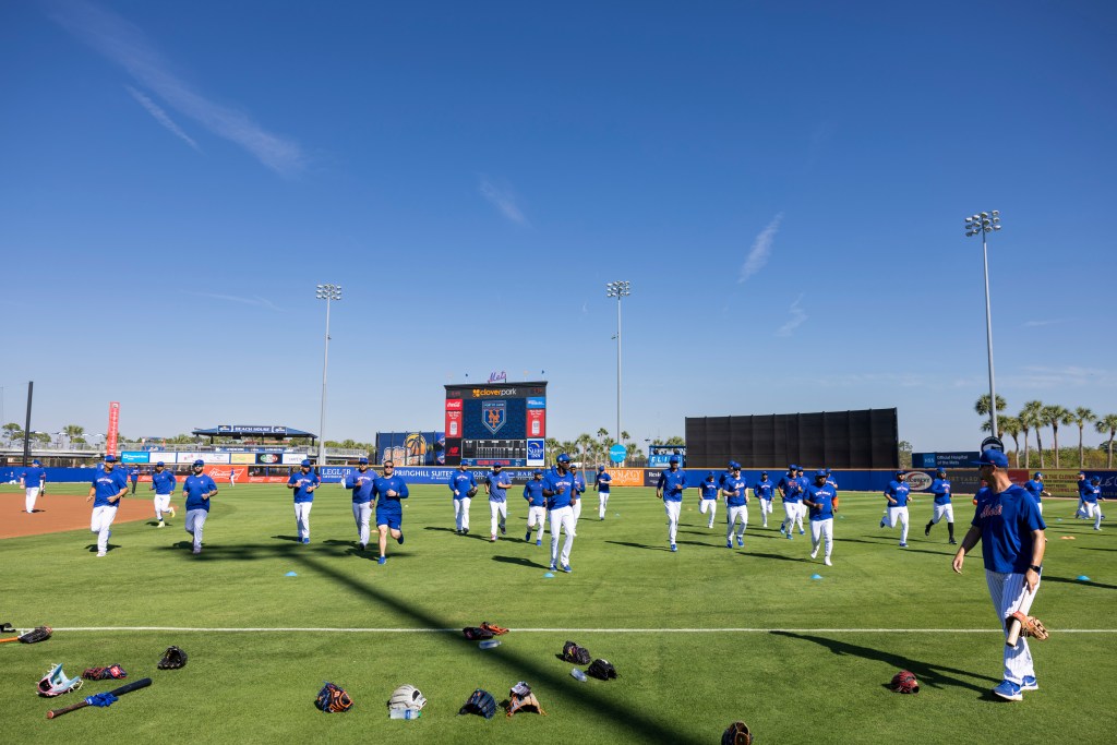 New York Mets stretching on the field before a Spring Training game against the Houston Astros.