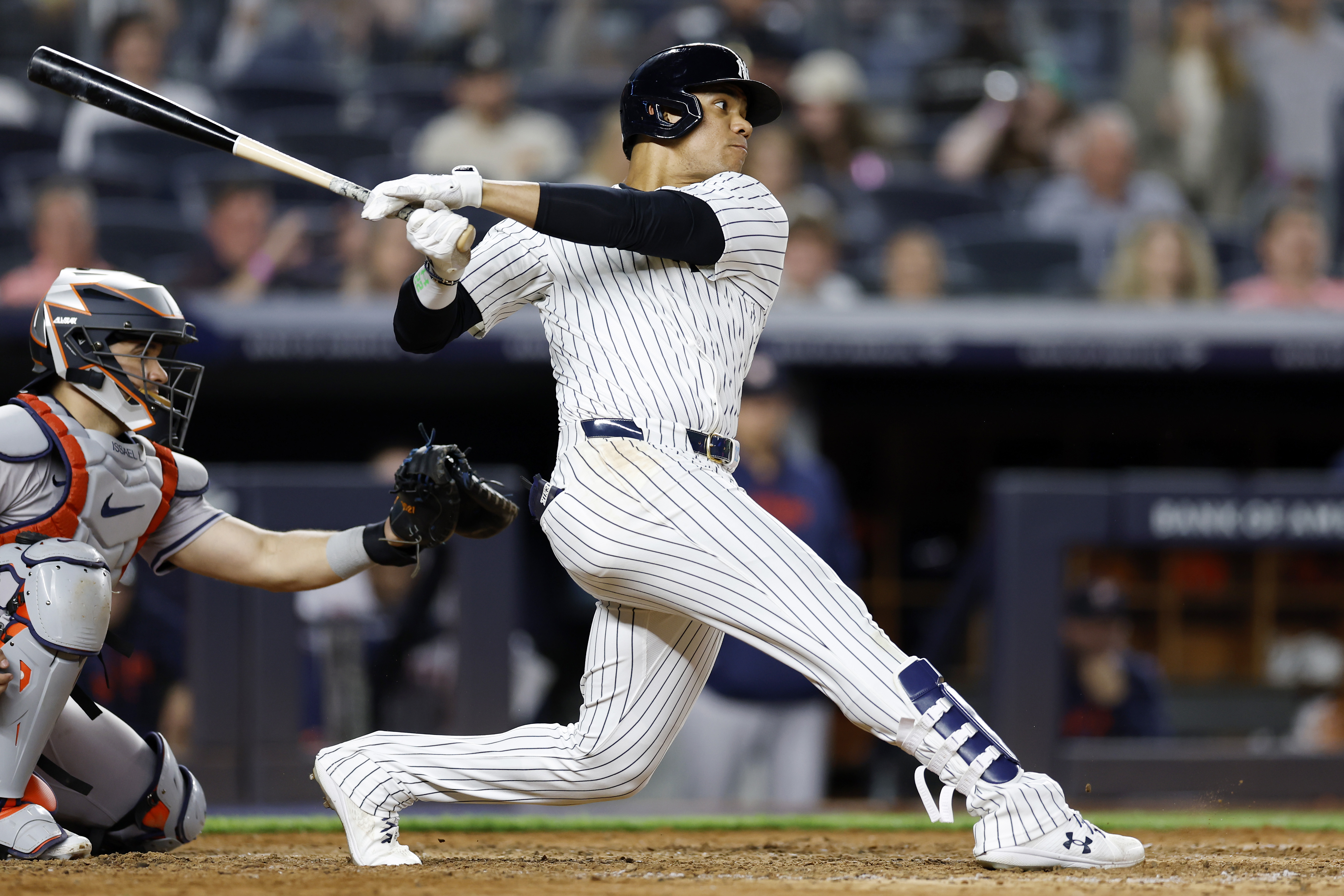 Juan Soto #22 of the New York Yankees hits an RBI single allowing Oswaldo Cabrera #95 (not pictured) to score during the eighth inning against the Houston Astros at Yankee Stadium on May 08, 2024 in the Bronx borough of New York City. 