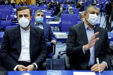 Iranian Atomic Energy Agency (IAEA) Chief Mohammad Eslami (R) and Iran's ambassador to the IAEA Kazem Gharibabadi attend the opening of the IAEA General Conference at their headquarters in Vienna, September 20, 2021.