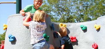 kids climbing on playground equipment