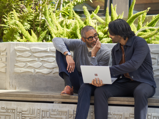  Colleagues collaborating in the courtyard.