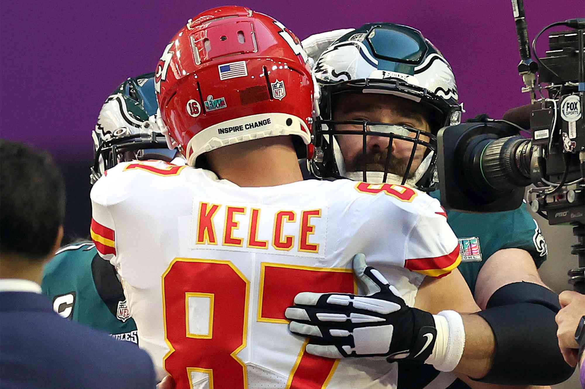 Travis Kelce #87 of the Kansas City Chiefs hugs Jason Kelce #62 of the Philadelphia Eagles before Super Bowl LVII at State Farm Stadium on February 12, 2023 in Glendale, Arizona.
