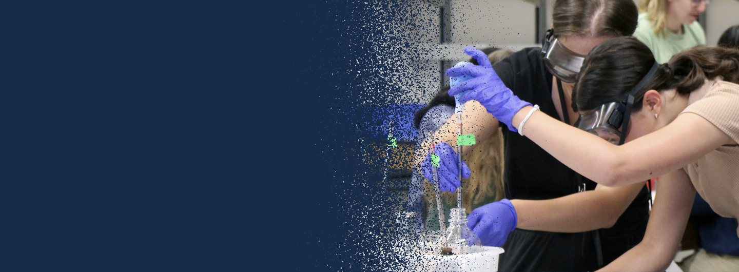 girls putting liquid into beakers