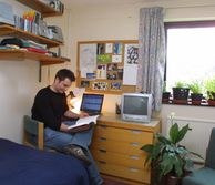 Student reading in room