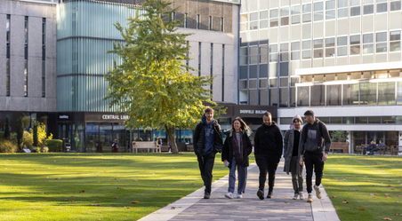 students walking in front of abdus salam library