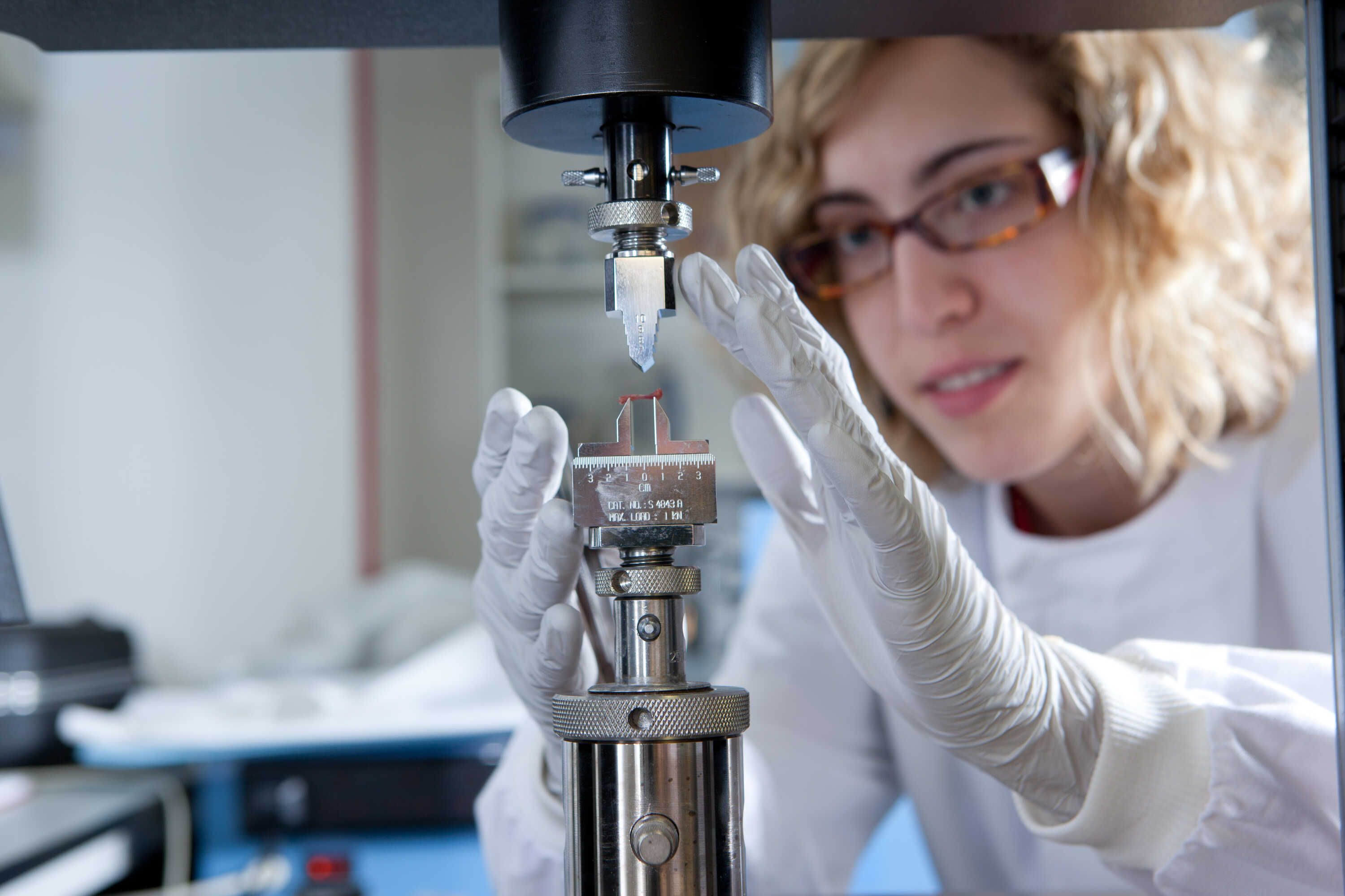 A bioengineering student testing bone density