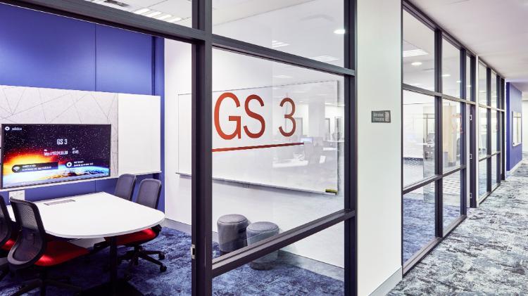 Bookable rooms on the ground floor of the Library with a tech-screen and whiteboards in the background