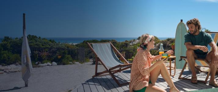 Two people chatting by the pool