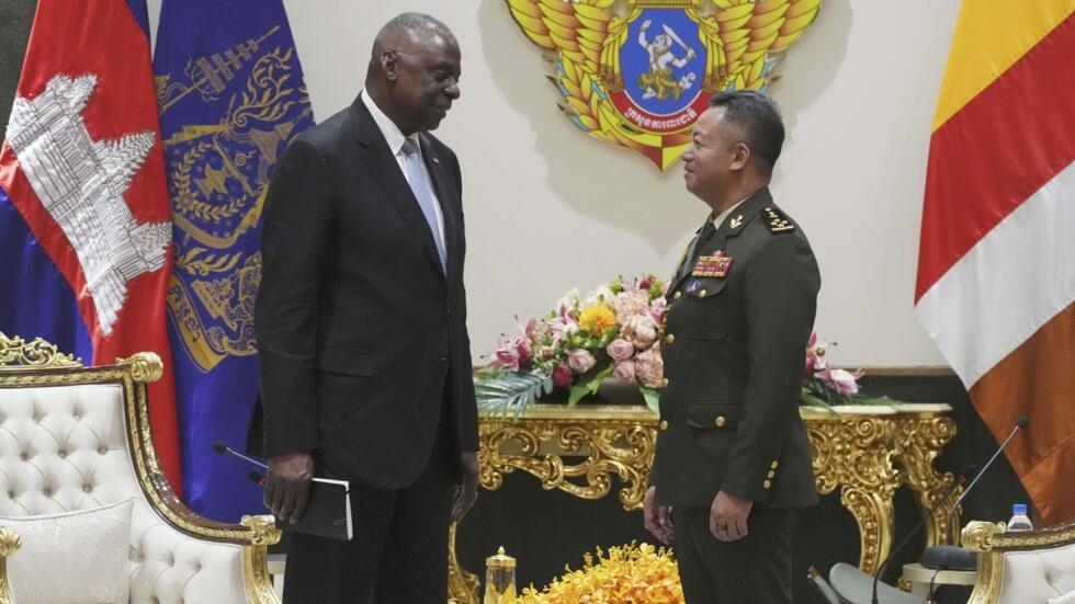 U.S. Defense Secretary Lloyd Austin, left, talks with Cambodian Defense Minister Tea Seiha at the Defense Ministry in Phnom Penh, Cambodia, Tuesday, June 4, 2024. Austin traveled to Cambodia on Tuesda