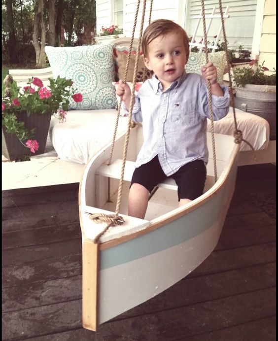Handmade wooden boat swing. Hang it from a tree, a porch, or swing set. It measures 33 inches long by 17 inches wide. The rope is an all natural: 
