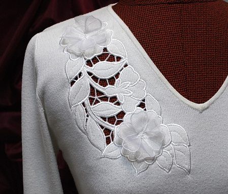 Advanced Embroidery Designs. Free Projects and Ideas.Wild Rose Cutwork Lace machine embroidery design on a knit sweater.