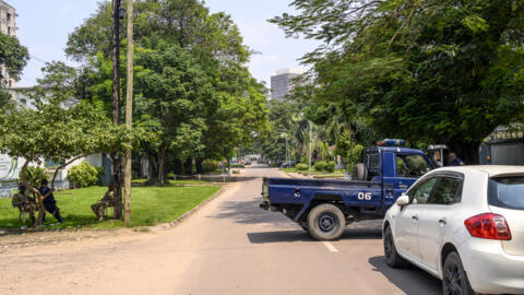 In this file photo, the Congolese Republican Guard and police block a road around the scene of what the army called “an attempted coup” in Kinshasa on May 19, 2024. 