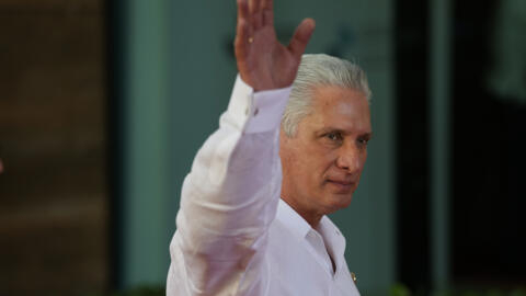 Cuba's President Miguel Diaz-Canel waves as he arrives for a summit in Santo Domingo, Dominican Republic, March 25, 2023.
