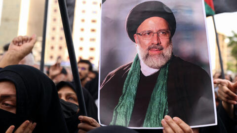 Iranians gather at Valiasr Square in central Tehran to mourn the death of President Ebrahim Raisi, Foreign Minister Hossein Amir-Abdollahian and seven others in a helicopter crash.